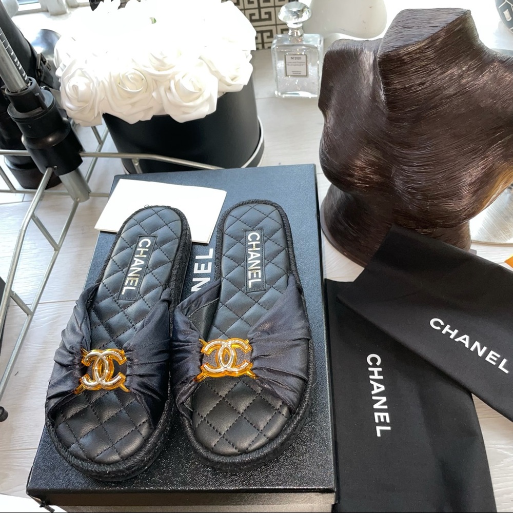 Sold Chanel black slides